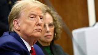 Former U.S. President Donald Trump sits with his lawyer Susan Necheles in the courtroom at a hearing in his criminal case on charges stemming from hush money paid to a porn star, in New York City on March 25, 2024.