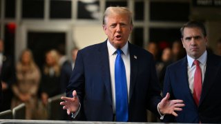 Former U.S. president and Republican presidential candidate Donald Trump arrives at Manhattan Criminal Court to attend his trial for allegedly covering up hush money payments linked to extramarital affairs in New York, on April 22, 2024. 