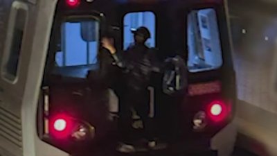 Rider spotted clinging to back of Metro train