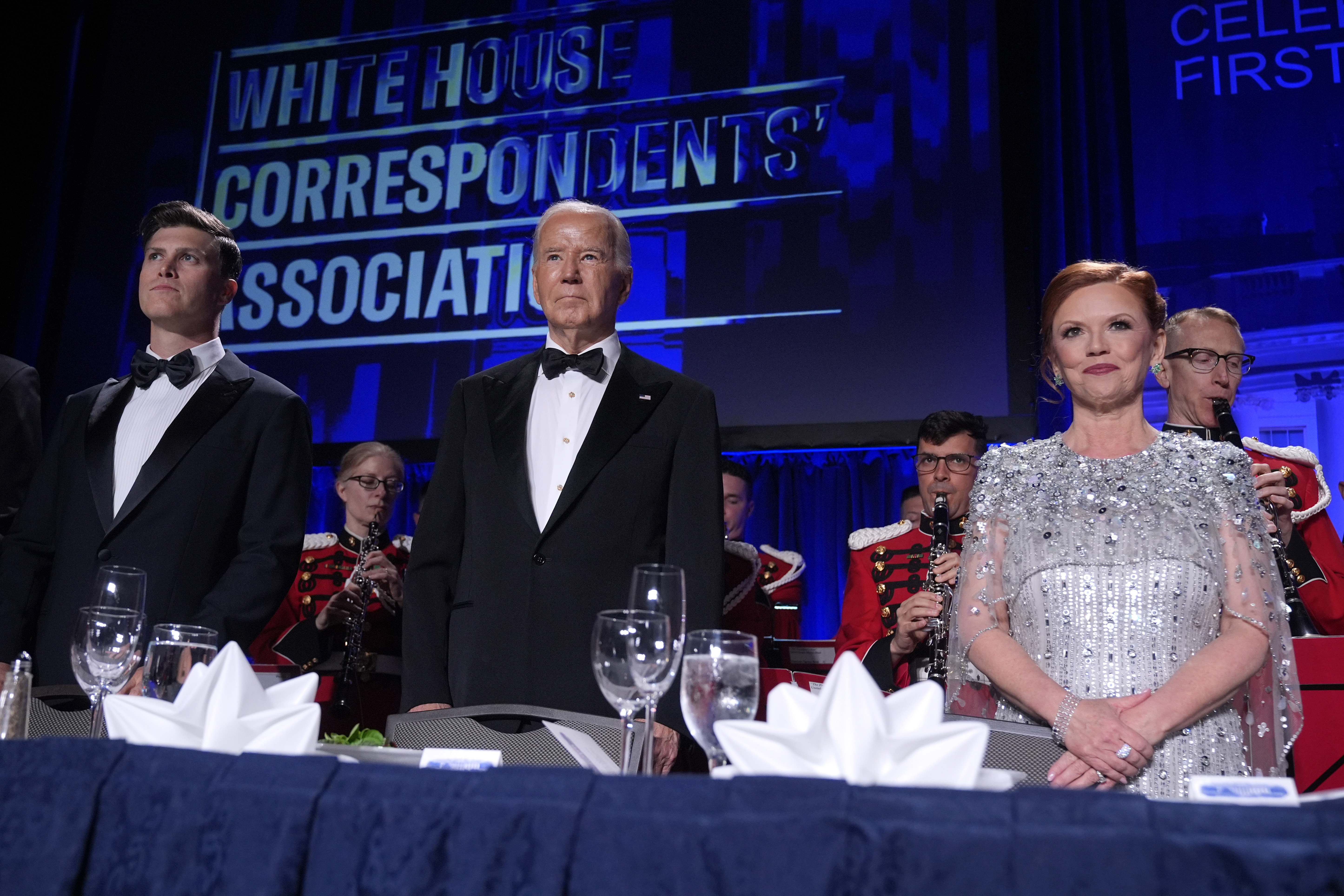 Host Colin Jost, from left, President Joe Biden and Kelly O'Donnell, WHCA president and Senior White House correspondent for NBC News