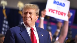 Former President Donald Trump speaks to guests at a rally