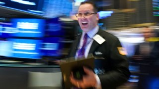 A trader works on the floor of the New York Stock Exchange.