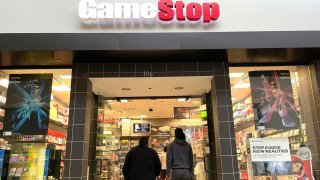 Customers enter a GameStop store in San Rafael, California.