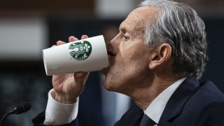 Howard Schultz, former chief executive officer of Starbucks Corp., drinks from a Starbucks mug during a Senate Health, Education, Labor, and Pensions Committee hearing in Washington, DC, US, on Wednesday, March 29, 2023.