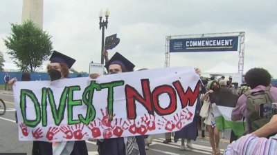 Protesters gather outside fenced-in GW graduation on National Mall