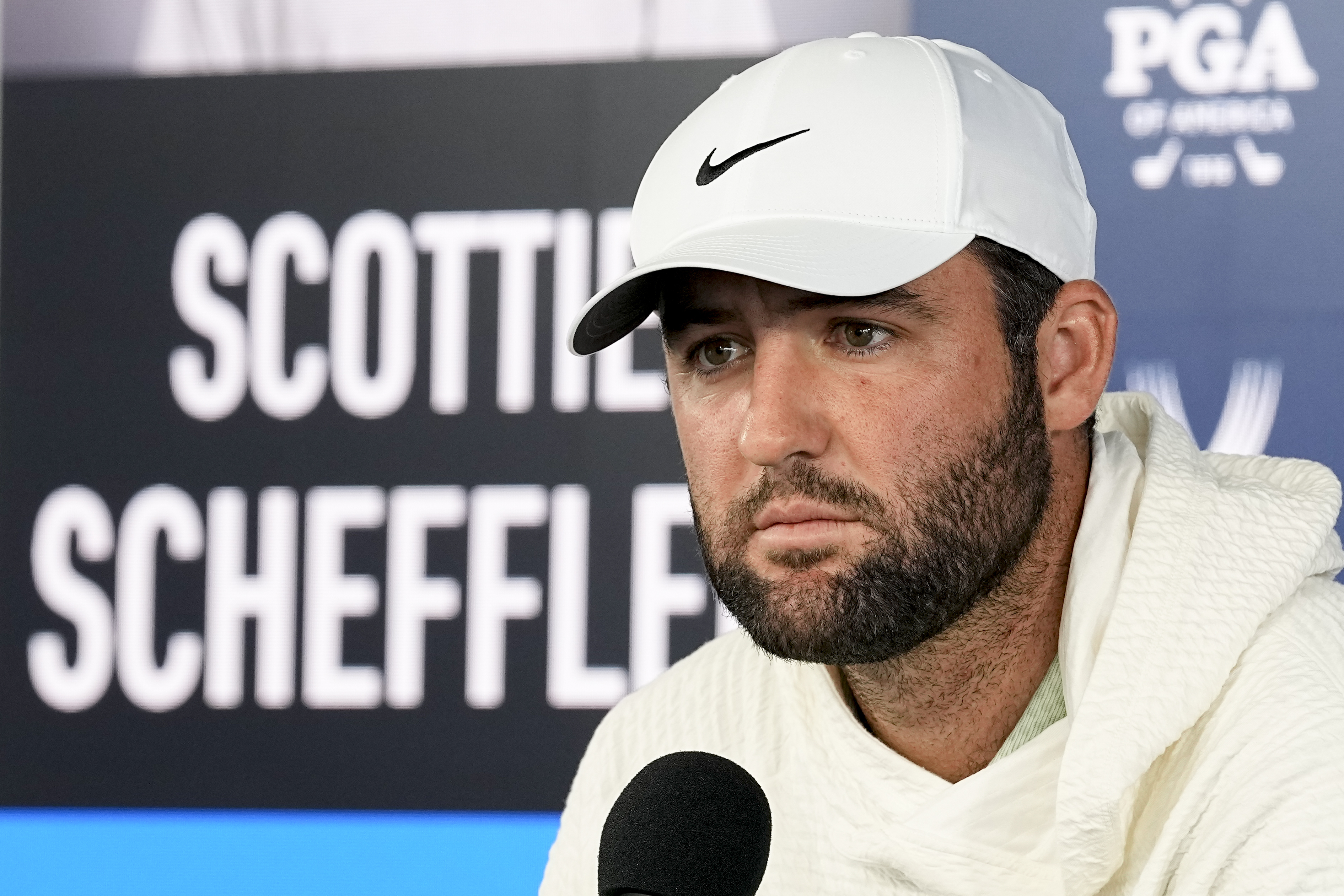 Scottie Scheffler, from the course to jail and back: What to know
about his PGA Championship arrest