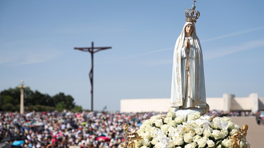 A statue of Our Lady of Fatima is pictured during a procession at the Shrine of Fatima, central Portugal, on May 13, 2022. – Thousands of pilgrims converged on the Fatima Sanctuary to celebrate the anniversary of Fatima’s miracle when three shepherd children claimed to have seen the Virgin Mary in May 1917.