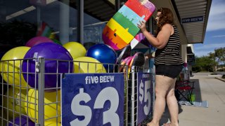 A shopper browses a selection of body boards outside a Five Below store in Bloomington, Illinois, on July 25, 2018.