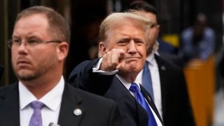 Former US President and Republican presidential candidate Donald Trump points as he arrives back at Trump Tower after being convicted in his criminal trial in New York City, on May 30, 2024.