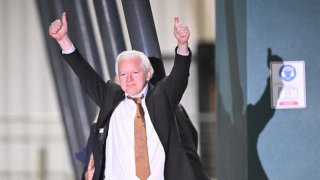 WikiLeaks founder Julian Assange gives a thumbs-up after arriving at Canberra Airport in Canberra on June 26, 2024.