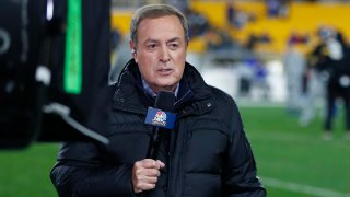FILE - NBC Sports commentator Al Michaels reports from the sidelines before an NFL football game between the Pittsburgh Steelers and the Buffalo Bills in Pittsburgh, on Dec. 15, 2019.