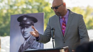 FILE – Steve Woodson speaks during a medal ceremony for his father, Cpl. Waverly B. Woodson Jr., to be posthumously honored with the Bronze Star and Combat Medic Badge, Oct. 11, 2023 at Arlington National Cemetery in Arlington, Va.