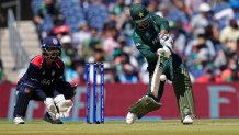 Pakistan's Shadab Khan, right, plays a shot during the ICC Men's T20 World Cup cricket match between United States and Pakistan at the Grand Prairie Stadium in Grand Prairie, Texas, Thursday, June 6, 2024.