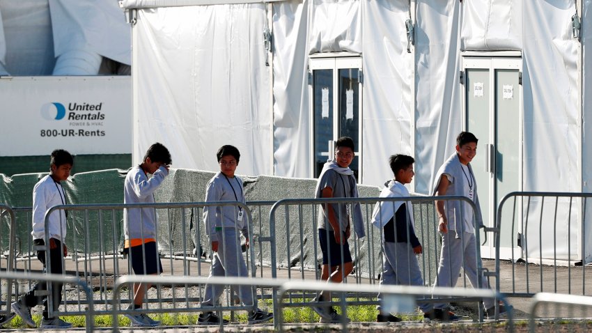 FILE – In this Feb.19, 2019 file photo, children line up to enter a tent at the Homestead Temporary Shelter for Unaccompanied Children in Homestead, Fla. For 27 years, federal courts have held special oversight over custody conditions for child migrants. The Biden administration wants a judge to partially lift those powers on Friday, June 21, 2024.