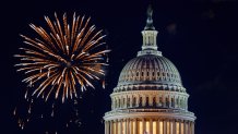 Mysterious night sky with full moon United States Capitol Building in Washington DC with Fireworks Background For 4th of July Independence Day