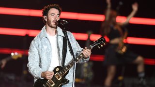 Kevin Jonas of Jonas Brothers performs during a stop of the group's Five Albums. One Night.
