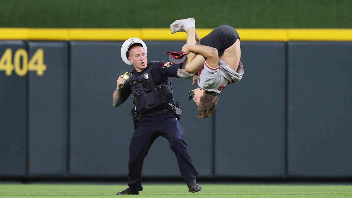 WATCH: Reds fan gets tased after running onto field and doing backflip ...