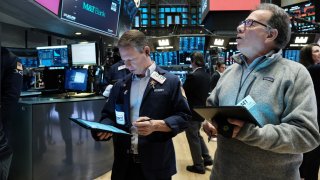 Traders work on the floor of the New York Stock Exchange (NYSE) on February 27, 2023 in New York City.