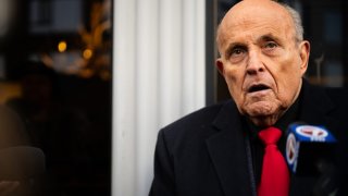 Rudy Giuliani speaks to members of the media where Florida Gov. Ron DeSantis was scheduled to host a campaign event in Manchester, New Hampshire, on Jan. 21, 2024.