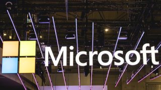 A logo sits illuminated at the Microsoft booth in the Mobile World Congress 2024 in Barcelona on Feb. 26, 2024.