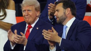 Republican presidential nominee and former U.S. President Donald Trump and Republican vice presidential nominee J.D. Vance applaud during Day 1 of the Republican National Convention (RNC), at the Fiserv Forum in Milwaukee, Wisconsin, U.S., July 15, 2024. 