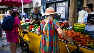 People shopping at the downtown market, Cour Lafayette, in Toulon, on July 27, 2024.