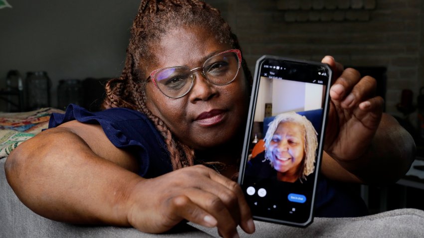 Janet Jarrett shows a photo of her sister, Pamela Jarrett, she keeps on her phone at the home they shared Friday, July 19, 2024, in Spring, Texas. Pamela Jarrett passed away after suffering heat related distress due to the power outage caused by hurricane Beryl.