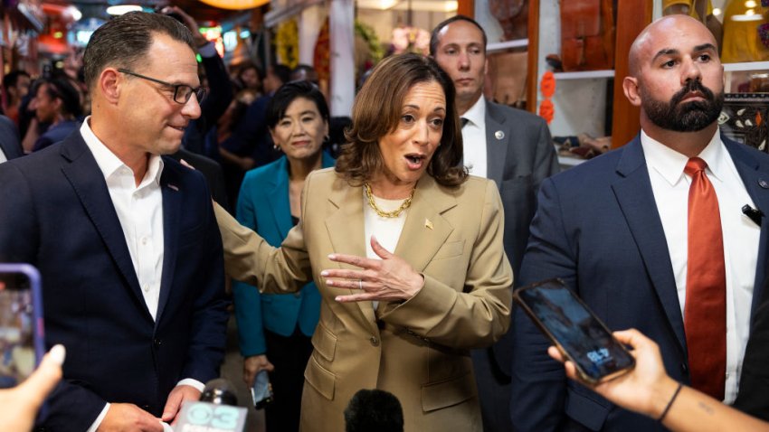 Vice President Kamala Harris and Pennsylvania Governor Josh Shapiro (L) speak to the press while making a stop at the Reading Terminal Market in Philadelphia, Pennsylvania, July 13, 2024. (Photo by RYAN COLLERD / AFP) (Photo by RYAN COLLERD/AFP via Getty Images)