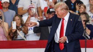 Former US President and 2024 Republican presidential candidate Donald Trump gestures after speaking during a campaign rally at Herb Brooks National Hockey Center in Saint Cloud, Minnesota, on July 27, 2024.