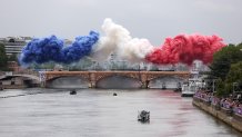 Smoke resembling the flag of Team France is shown over Austerlitz Bridge during the opening ceremony of the Olympic Games Paris 2024 on July 26, 2024 in Paris, France.