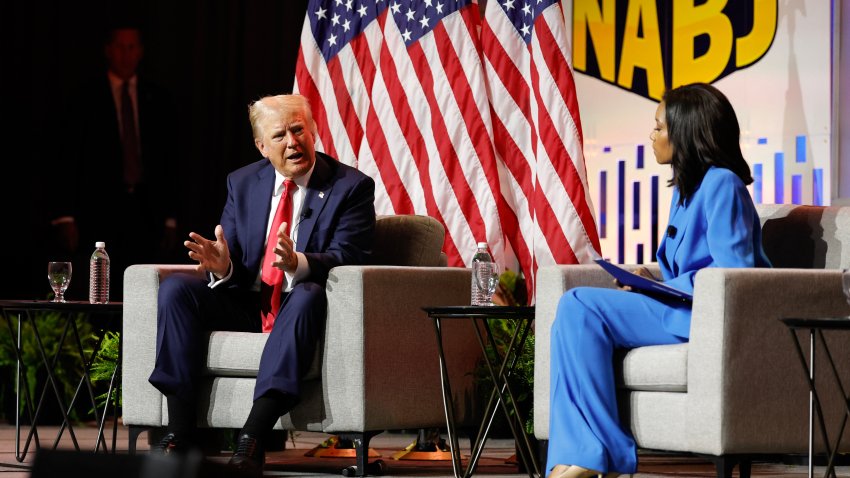 Former US President and 2024 Republican presidential nominee Donald Trump answers questions as moderator and journalist Rachel Scott (R) looks on during the National Association of Black Journalists annual convention in Chicago, Illinois, on July 31, 2024.