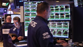 Traders work on the floor of the New York Stock Exchange during morning trading on May 31, 2024 in New York City. 