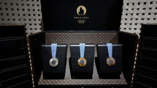 The 2024 Paris Olympic Games medals are displayed inside a custom-designed trunk manufactured by Louis Vuitton, an LVMH brand partner of the Paris Olympic and Paralympic Games, during a gathering at LVMH in Paris on July 22, 2024, ahead of the start of the 2024 Paris Olympic Games.