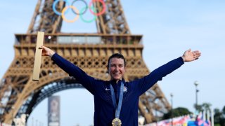 Gold medalist Kristen Faulkner of Team United States poses on the podium during the Women’s Road Race on day nine of the Olympic Games Paris 2024 at Trocadero on August 04, 2024 in Paris, France.