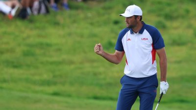 Scottie Scheffler wins gold medal in men's golf