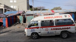 An ambulance is seen on the beach following an attack in Mogadishu