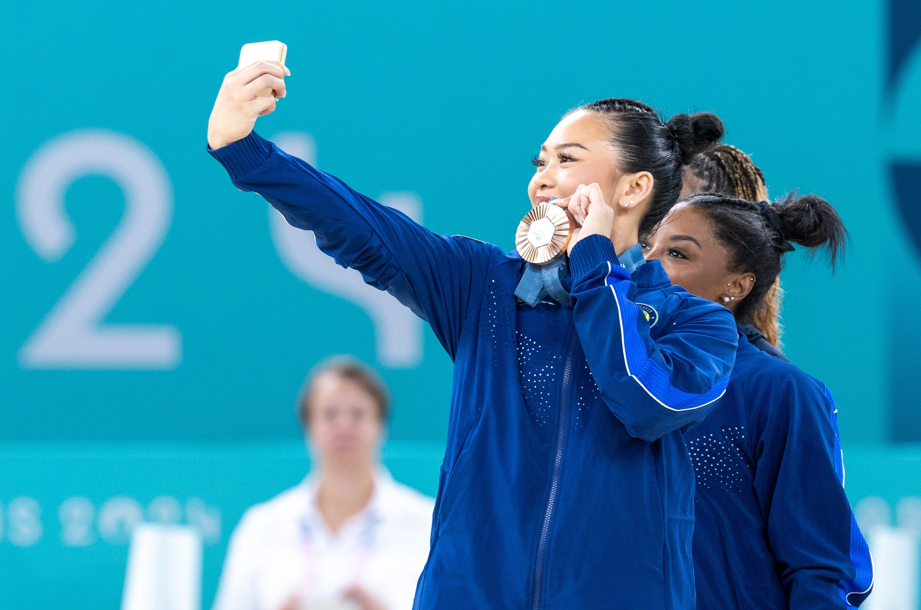 Suni Lee's long road back to the Olympics ended in a familiar spot: the medal stand