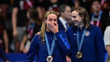 (R-L) Gold medallist US' Katie Ledecky and bronze medallist US' Paige Madden celebrate during the podium ceremony of the women's 800m freestyle swimming event during the Paris 2024 Olympic Games at the Paris La Defense Arena in Nanterre, west of Paris, on August 3, 2024. (Photo by Manan VATSYAYANA / AFP) (Photo by MANAN VATSYAYANA/AFP via Getty Images)