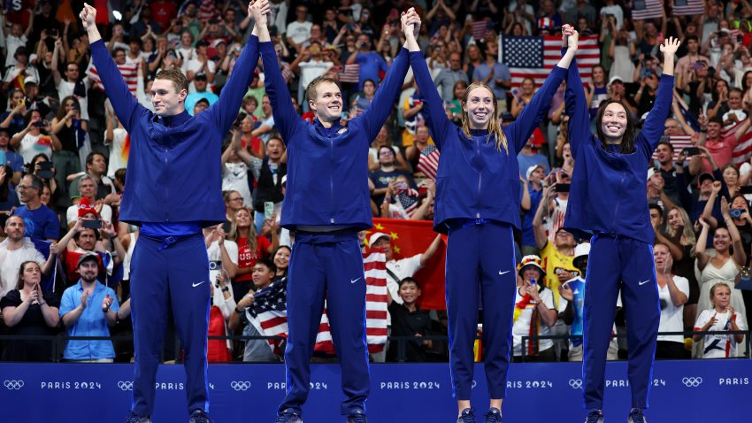 NANTERRE, FRANCE – AUGUST 03: Gold Medalists Ryan Murphy, Nic Fink, Gretchen Walsh and Torri Huske of Team United States celebrate on the podium during the Swimming medal ceremony after the Mixed 4x100m Medley Relay Final on day eight of the Olympic Games Paris 2024 at Paris La Defense Arena on August 03, 2024 in Nanterre, France. (Photo by Quinn Rooney/Getty Images)