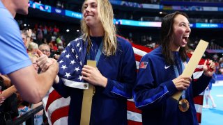 NANTERRE, FRANCE – AUGUST 04: Gold Medalists Gretchen Walsh and Torri Huske of Team United States celebrate with friends and family following the Swimming medal ceremony after the Women’s 4x100m Medley Relay Final on day nine of the Olympic Games Paris 2024 at Paris La Defense Arena on August 04, 2024 in Nanterre, France. (Photo by Maddie Meyer/Getty Images)