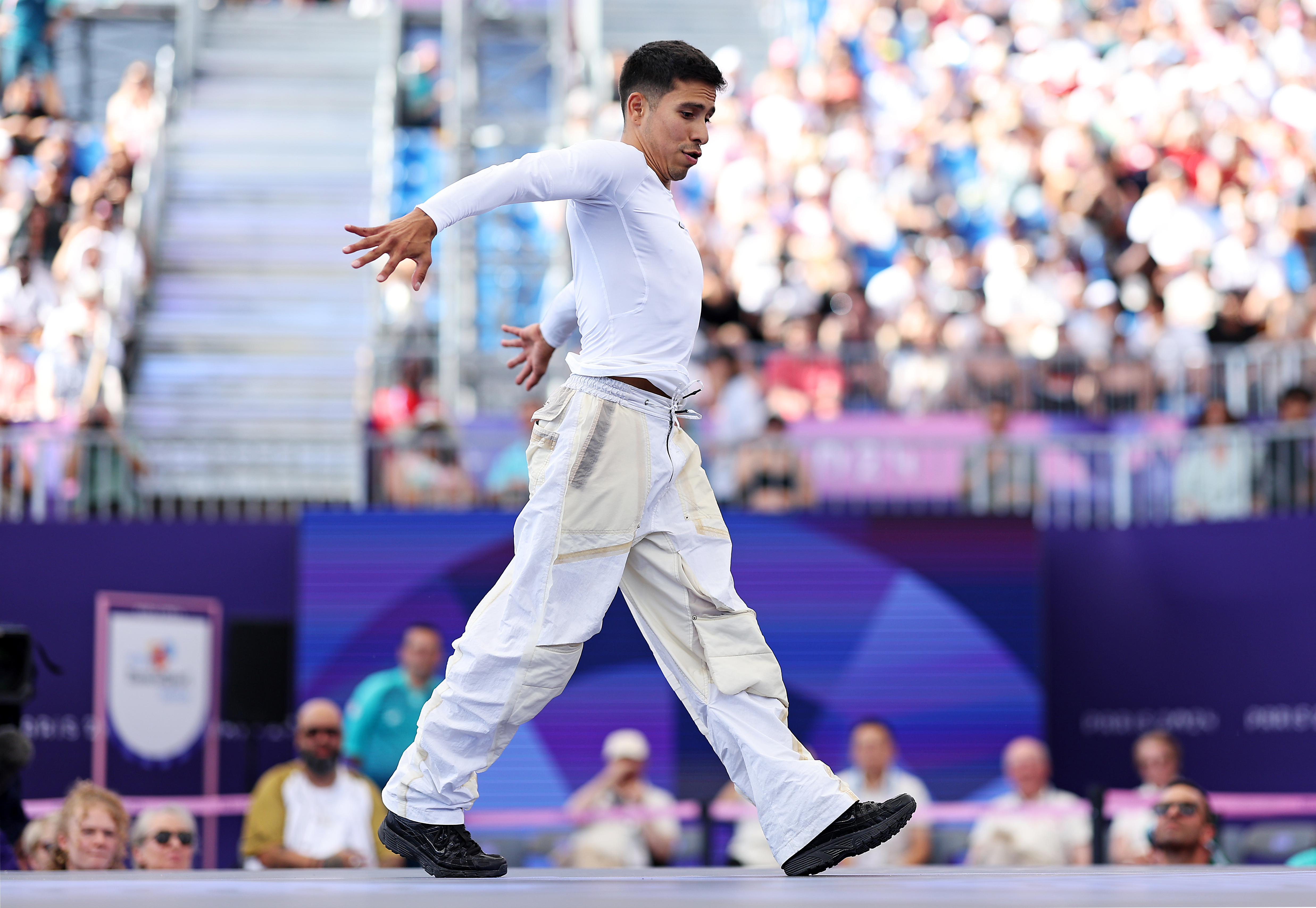 PARIS, FRANCE – AUGUST 10: B-Boy Victor of Team United States competes with B-Boy Shigekix of Team Japan (not pictured) in the Breaking B-Boys Round Robin Group A battle on day fifteen of the Olympic Games Paris 2024 at Place de la Concorde on August 10, 2024 in Paris, France. (Photo by Elsa/Getty Images)