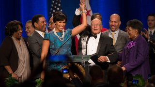 WASHINGTON, DC – JANUARY 2:    DC Mayor Muriel Bowser with her father and mother Joe and Joan Bowser after she was sworn in this morning along with other councilmembers in Washington, DC on January 2, 2015.     (Photo by Linda Davidson / The Washington Post via Getty Images)