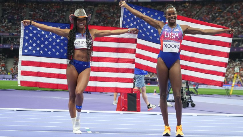 Tara Davis-Woodhall (USA) and Jasmine Moore (USA) react after finishing first and third in the women’s long jump final during the Paris 2024 Olympic Summer Games at Stade de France. Mandatory Credit: Kirby Lee-USA TODAY Sports