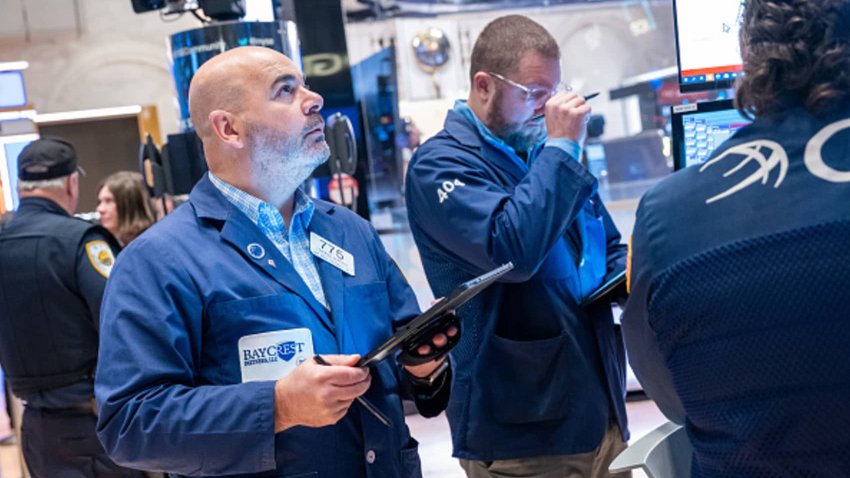 Traders work on the floor of the New York Stock Exchange (NYSE) on the first trading day of 2024 on January 02, 2024 in New York City. 