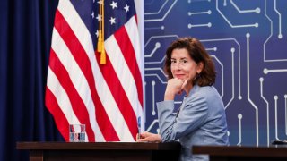 Secretary of Commerce Gina Raimondo listens as President Joe Biden participates virtually in a meeting on the Creating Helpful Incentives to Produce Semiconductors (CHIPS) for America Act at the White House on July 25, 2022.