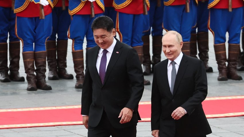 In this pool photograph distributed by the Russian state agency Sputnik, Russia’s President Vladimir Putin and Mongolia’s President Ukhnaagiin Khurelsukh walk past honour guards during an official welcoming ceremony in Ulaanbaatar on September 3, 2024. 