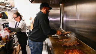 Antonio Munoz, owner of the 911 Taco Bar restaurant, prepares carne asada and chicken, meats that have increased in price and costs for his business with recent inflation, in Las Vegas, Nevada on February 1, 2024. 