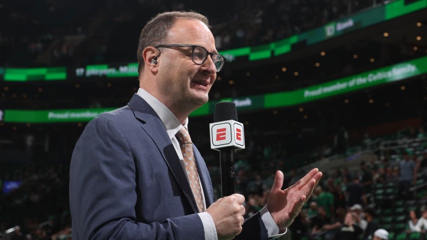 ESPN Analyst, Adrian Wojnarowski reports on the game between the Miami Heat and the Boston Celtics during Game 4 of the 2022 NBA Playoffs Eastern Conference Finals on May 23, 2022 at the TD Garden in Boston, Massachusetts. 