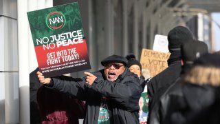 Members of the National Action Network protest outside the office of hedge fund billionaire Bill Ackman on January 04, 2024 in New York City. 