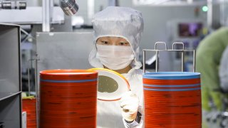 HUAI’AN, CHINA – APRIL 29, 2024 – A worker produces chips for mobile phones, cars, LED lighting at a workshop in Huai ‘an city, Jiangsu province, China, April 29, 2024. 